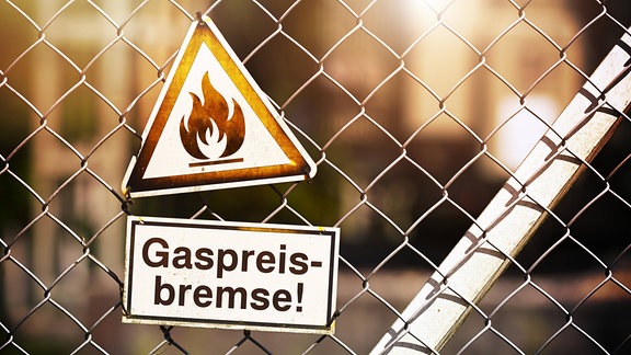 FOTOMONTAGE, Schild mit Gasflamme und der Aufschrift Gaspreisbrems
