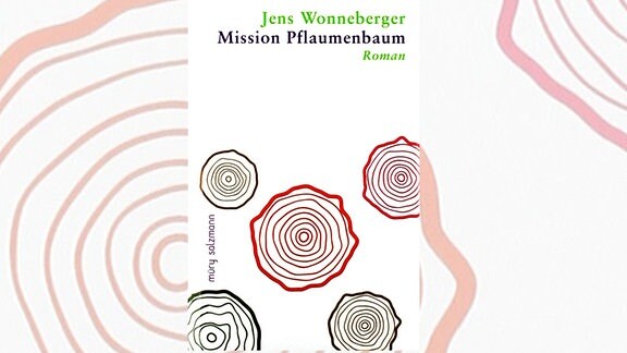 Das  Buchcover von "Mission Pflaumenbaum" von Jens Wonneberger, bunte Kreise auf weißem Hintergrund.