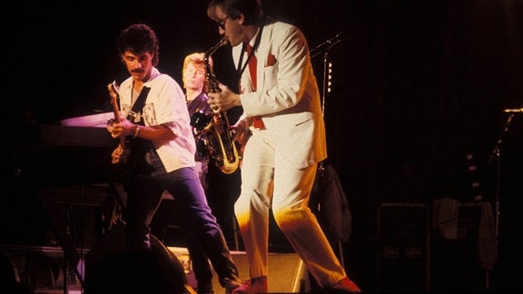 John Oates und Charlie DeChant während eines Konzerts, 1984
