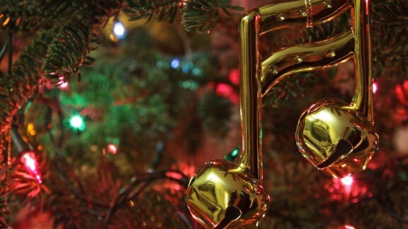 Glöckchen in Form einer Note als Weihnachtsbaumbehang