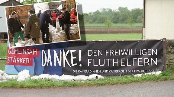 Ein Banner mit der Aufschrift "Danke! Den freiwilligen Fluthelfern" in Berga