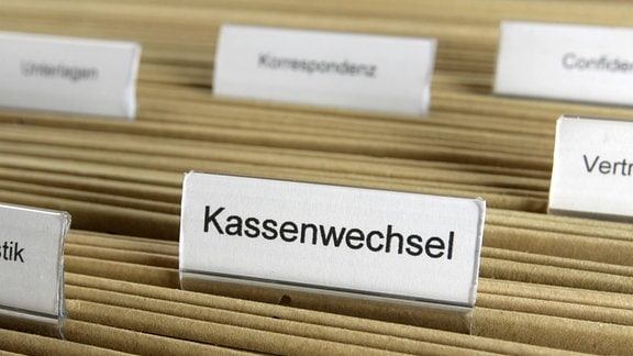 Karteireiter mit der Aufschrift Kassenwechsel