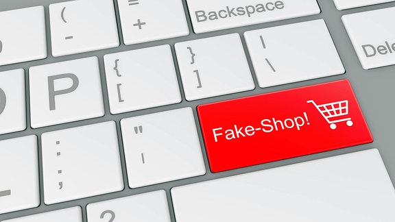 Illustration - Das Wort "Fake-Shop!" steht auf der roten Entertaste einer symbolischen Computertastatur geschrieben