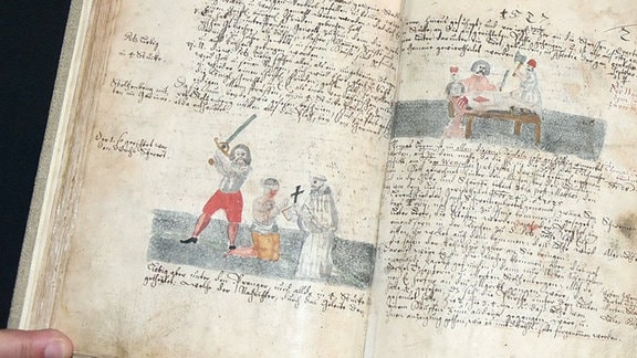 Historisches Buch - auf einer Seite illustrierte Szene mit Richtschwert