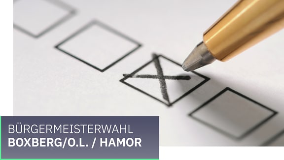 Wahl Gemeinde Boxberg/O.L. / Hamor . Ein Kreuz wird mit einem Stift auf einem Zettel gesetzt.