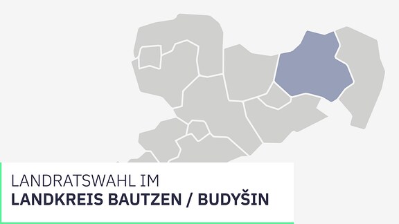 Wahl Landkreis Bautzen / Budyšin. Ein Kreuz wird mit einem Stift auf einem Zettel gesetzt.