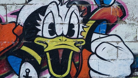 Mauer mit Donald Duck Graffiti