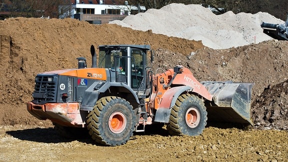 Hitachi ZW310 Radlader auf einer Baustelle.