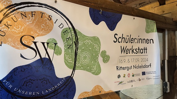 Ein Banner auf dem "Schüler:innen Werkstatt" steht