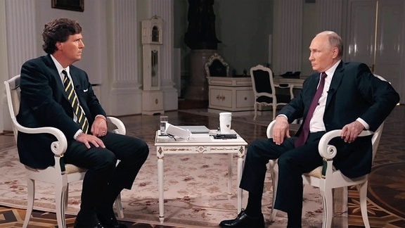 Wladimir Putin und Tucker Carlson