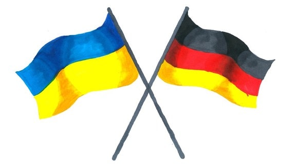 Ukrainische und deutsche Flagge gekreuzt