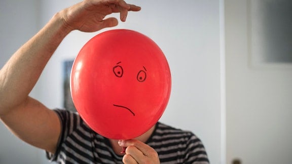Luftballon mit traurigem Gesicht