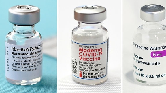 Ein Fläschchen (l-r) mit dem Corona-Impfstoff von Biontech/Pfizer und ein Fläschchen des Corona-Impfstoffs des US-Konzerns Moderna stehen auf einem Tisch im Hartford Hospital. 