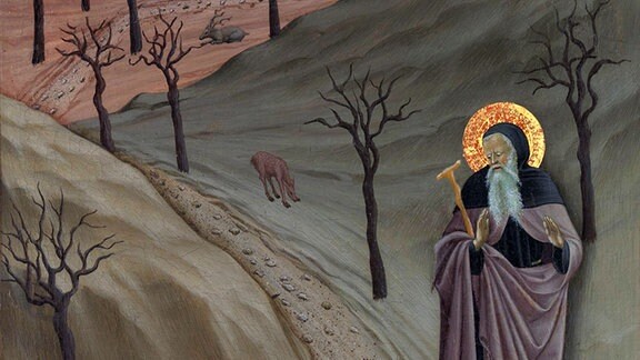Italienisches Renaissance-Gemälde. Der Einsiedler Sankt Antonius Abt in einer Wüstenlandschaft mit Tieren, die die Versuchungen des Teufels symbolisieren