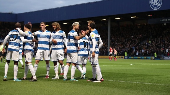 Charlie Austin of Queens Park Rangers celebrates scoring the opening goal with team-mates Queens Park Rangers v Sheffield United