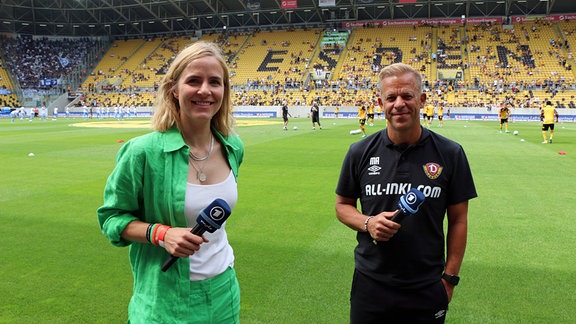 Stephanie Müller-Spirra (ARD-Moderatorin) und Markus Anfang (Trainer Dynamo Dresden) stehen nebeneinander.