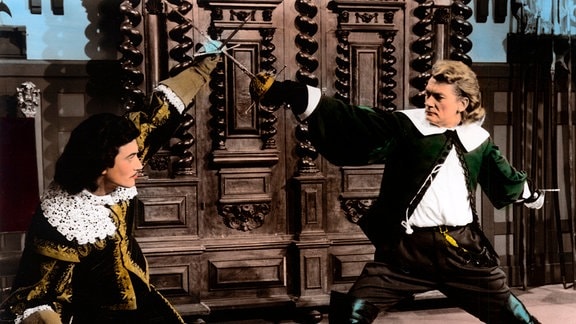 Der verarmte Edelmann und Schauspieler Fracass (Jean Marais, r.) kämpft gegen den dreisten Grafen de Vallombreuse (Gérard Barry).