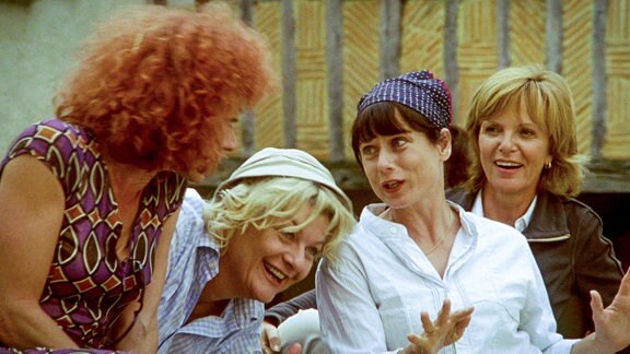 Vier lachende Frauen.