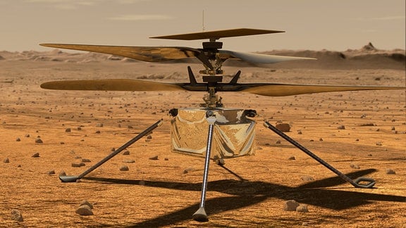 Eine silberner Kleinhelikopter steht auf der Marsoberfläche.