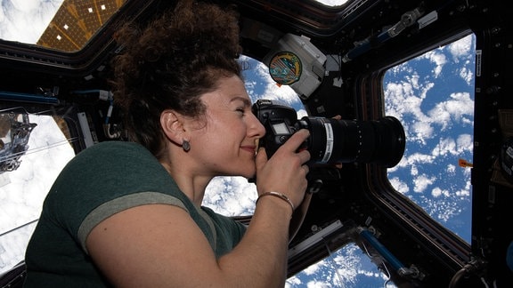 NASA astronaut and Expedition 62 Flight Engineer Jessica Meir photographs the Earth
