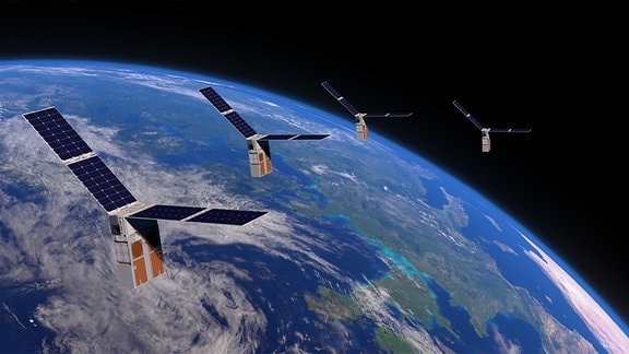 Eine künstlerische Weltraumdarstellung des Satelliten-Schwarm Starling in der nahen Erdumllaufbahn